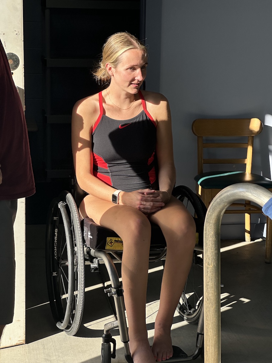 woman in a wheel chair preparing to scuba dive with IMURS